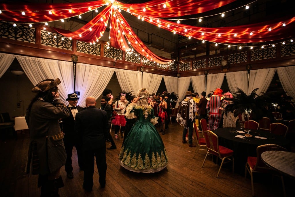 A couple in masquerade costumes